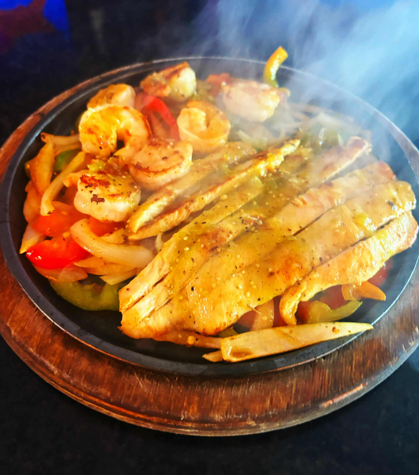 Sizzling fajitas served at El Molcajete Cantina & Grill